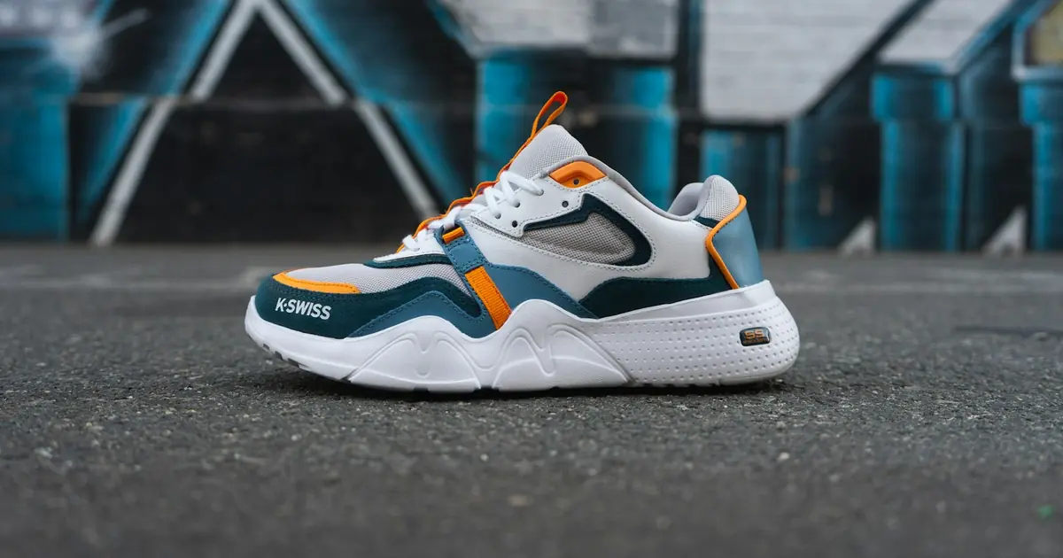 Sidewalk flat-lay with walking sneakers for casual walking shoes